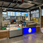 An interior shot of the Auntie Anne's kiosk located on The Moor in Sheffield with the brightly lit glass counter displaying the freshly baked, hand-rolled pretzels in a variety of sweet & savoury flavours.