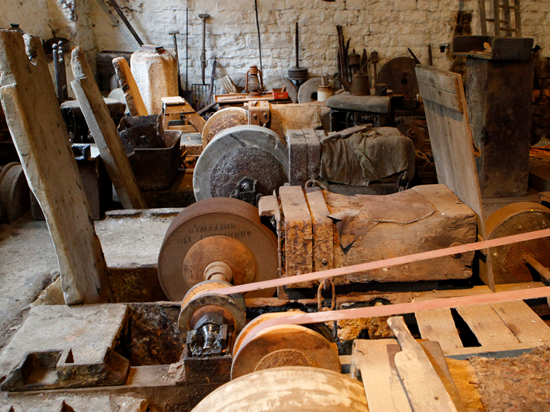 A room full of water powered machinery at the Shepherd Wheel Workshop.