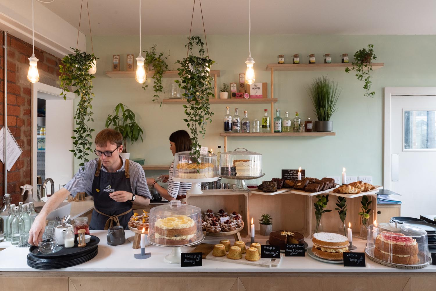 Staff working behind the counter at the Birdhouse Tea Bar & Kitchen.