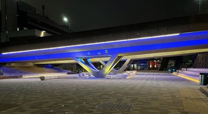 neon lighting under the bridge, next to the concourse outside the University of Sheffield Students' Union