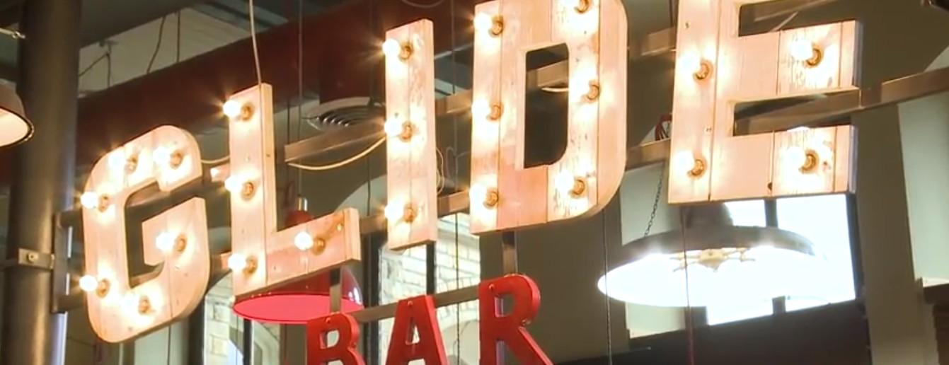 The Glide Bar's sign lit up.