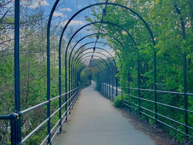 Five Weirs Walk bridge on a sunny day.