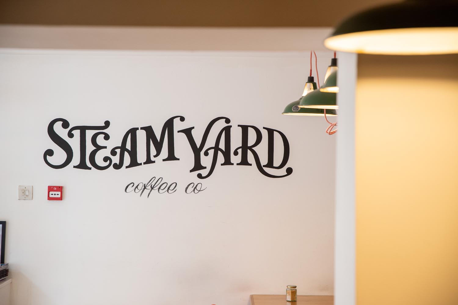 The Steam Yard logo painted on a wall.