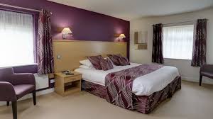Deluxe bedroom at Best Western Plus Mosborough Hall Hotel with king-size bed and modern furnishings.