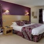 Deluxe bedroom at Best Western Plus Mosborough Hall Hotel with king-size bed and modern furnishings.