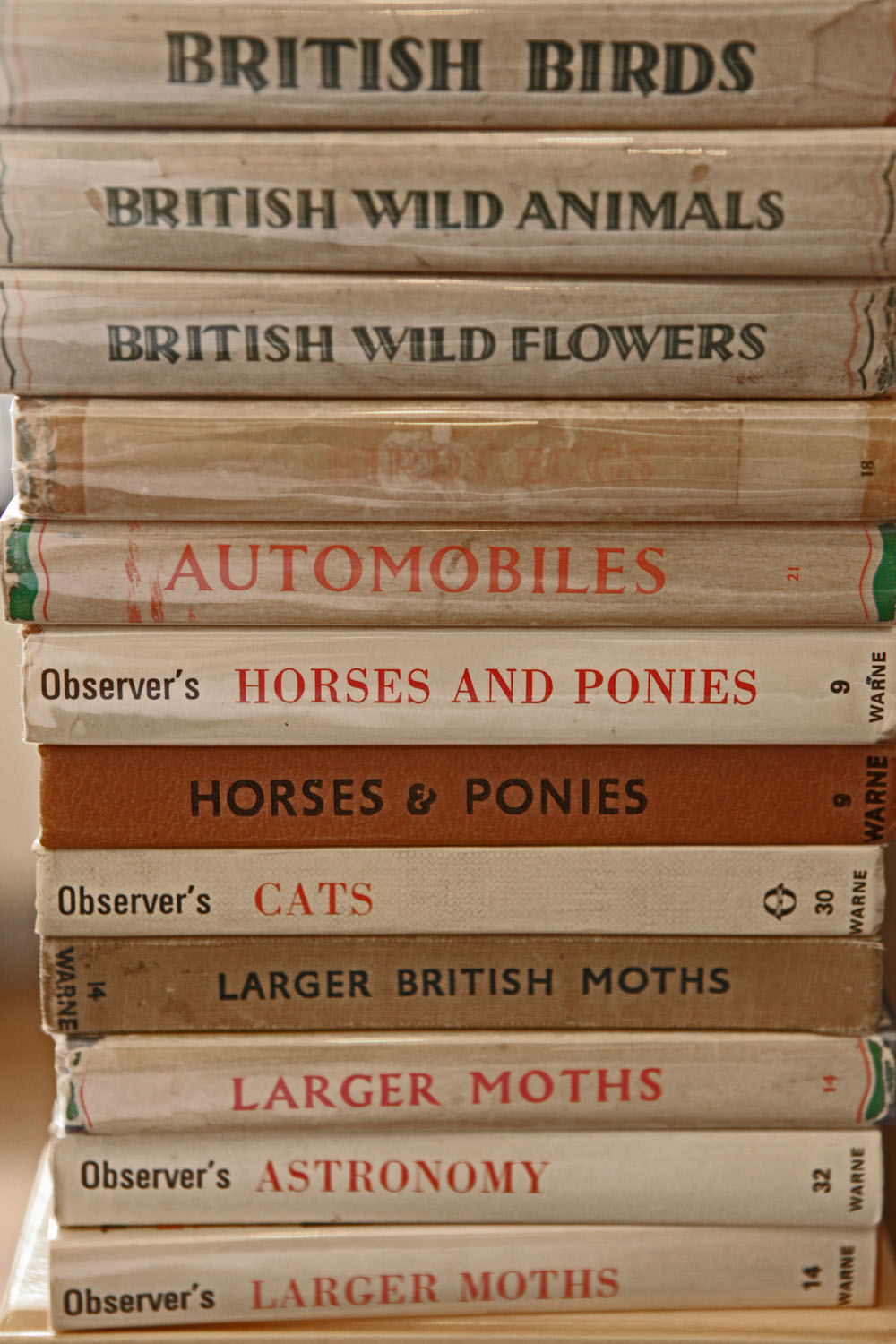 A stack of books on animal and plants.
