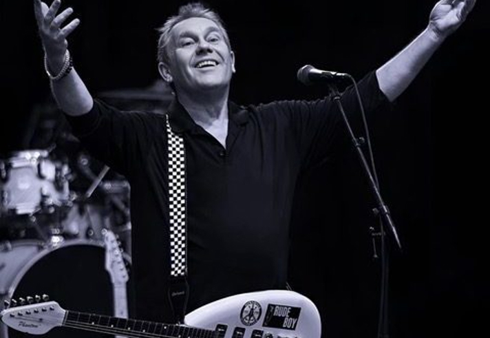 A black and white photo of the band The Beat.