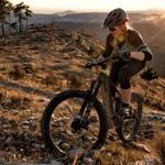 A woman peddling up a steep slope at Fox Valley on a mountain bike.
