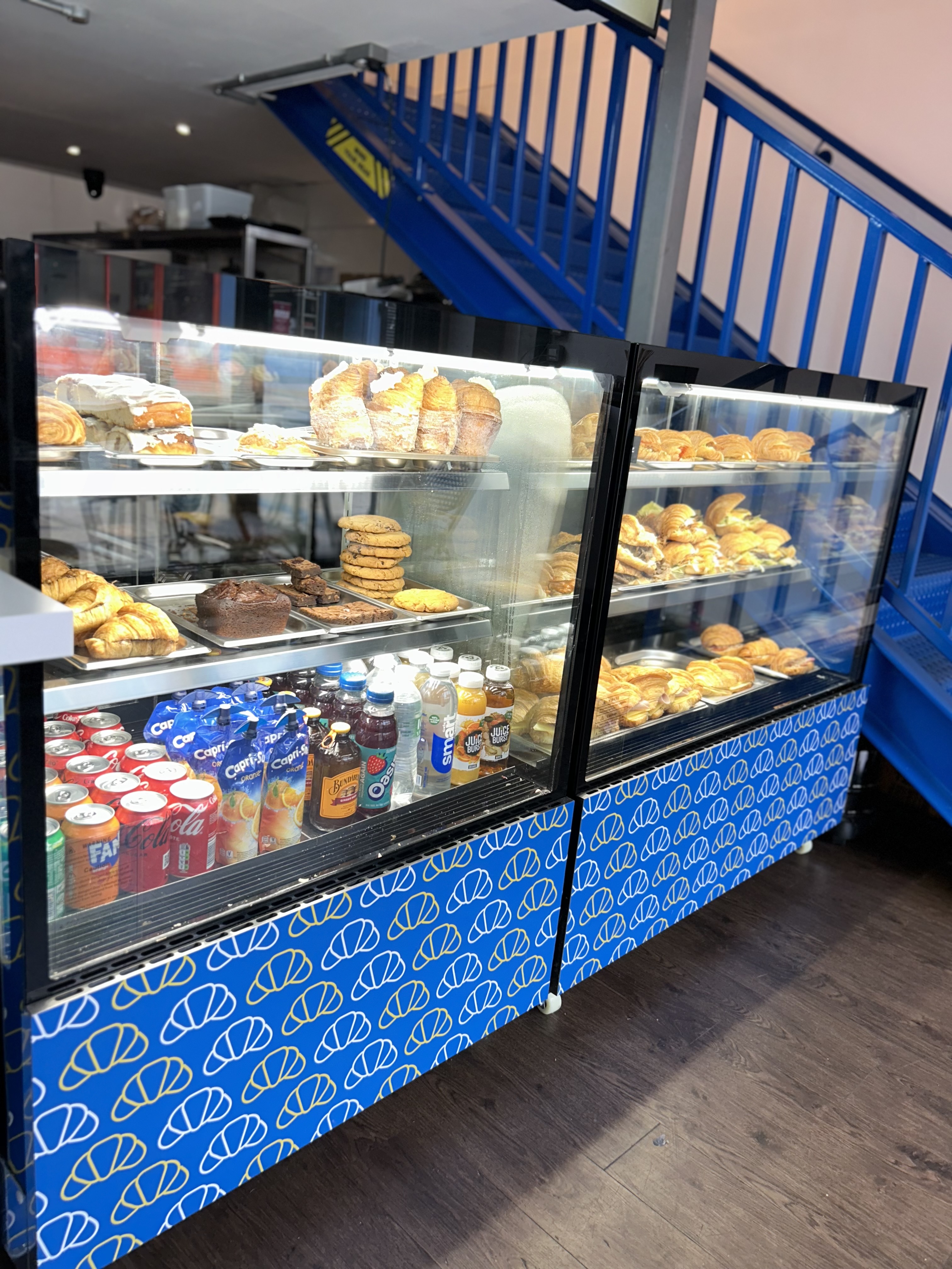 A window display of the food selection in a glass display