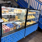 A window display of the food selection in a glass display
