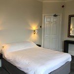 Coniston Guest House – bedroom with a double bed and bedside lights