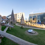A view across Pound's Park, showing the play equipment and beches.