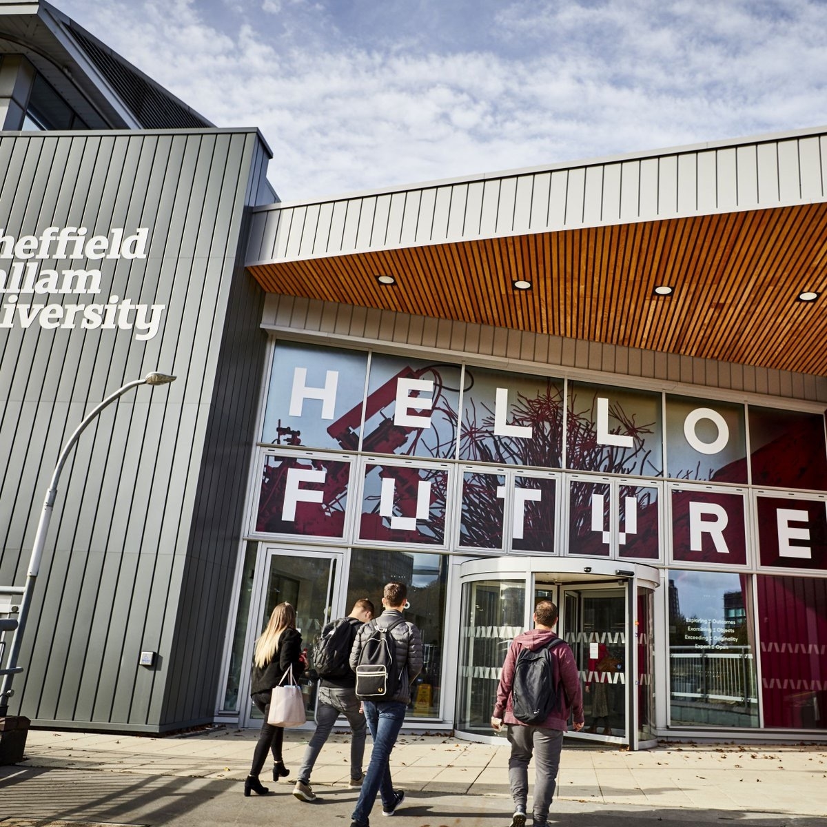 A building with the words 'Hello Future' spelled out on the glass frontage.