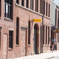 The exterior of a red brick building.