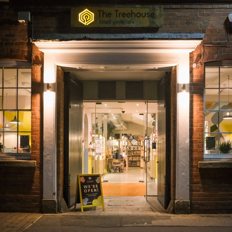 The entrance to The Treehouse Cafe, at night.