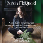 Promo image for the event, featuring Sarah McQuaid sat on a wooden floor. Behind her is an upright piano.