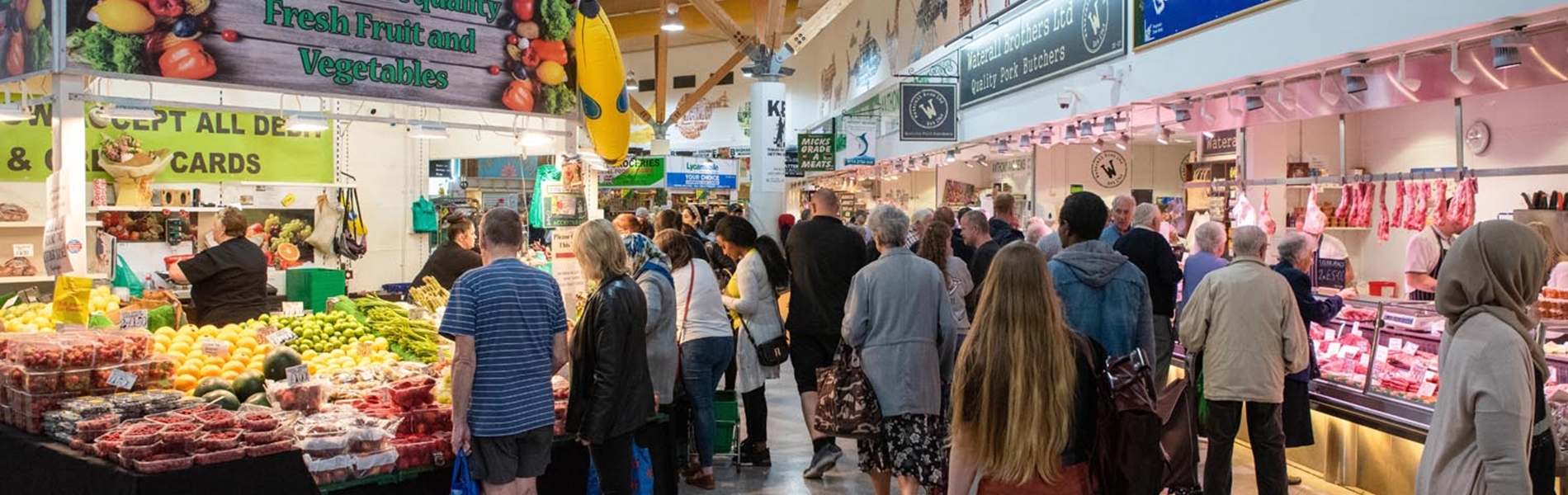 Stalls at The Moor Market surrounded by shoppers.