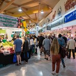 Stalls at The Moor Market surrounded by shoppers.