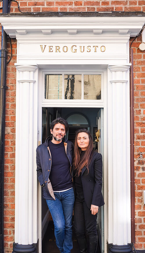 A couple stand in the doorway of VeroGusto.