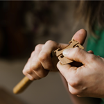 Emma Hardy from Hardy Violins hand-carving the bridge for a violin.