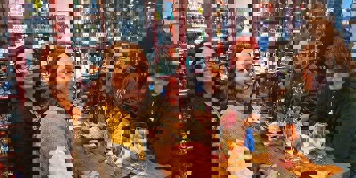 Four people enjoying a night out at Craft & Berry.