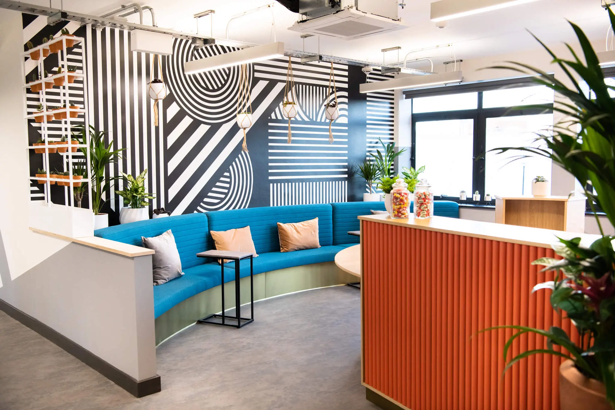 A reception area with chairs and a workstation.