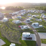 Aerial view of Waleswood Caravan and Camping Park showing caravans, camping pitches, and surrounding countryside.