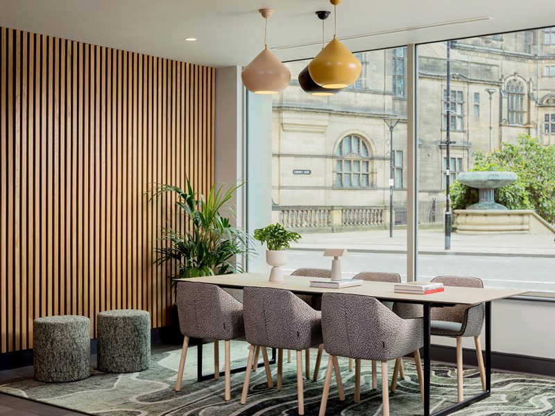 Reception area with table and chairs.