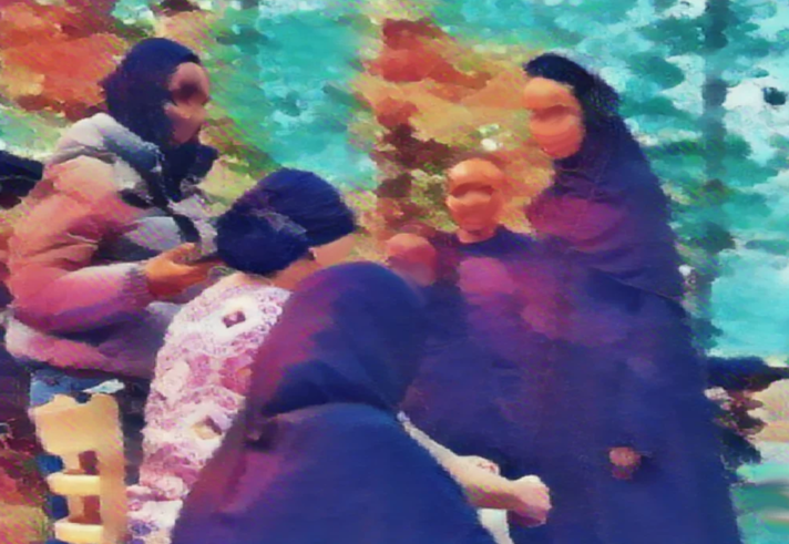 A blurred image of a group of people.