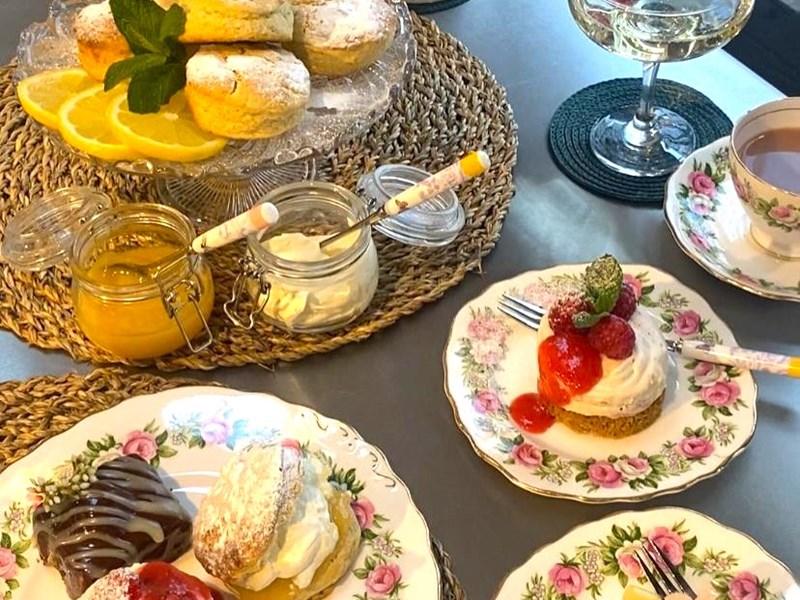 Various cakes and desserts on display.