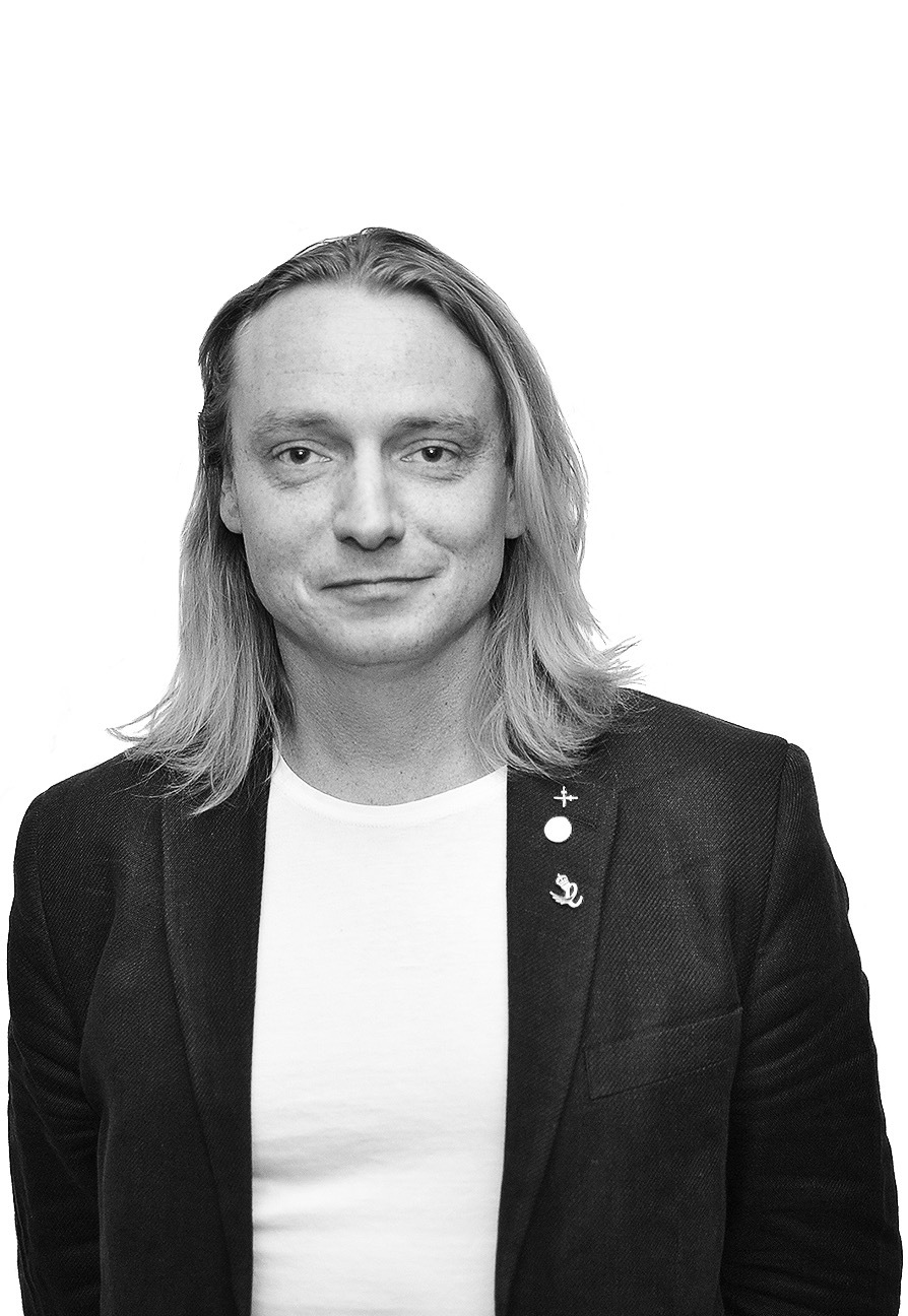 A black and white portrait of Sam Chapman.