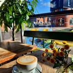 A coffee on a table at The Grind Café.