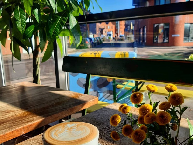 A coffee on a table at The Grind Café.