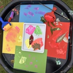 Some artwork created by children, with paints and stamps.