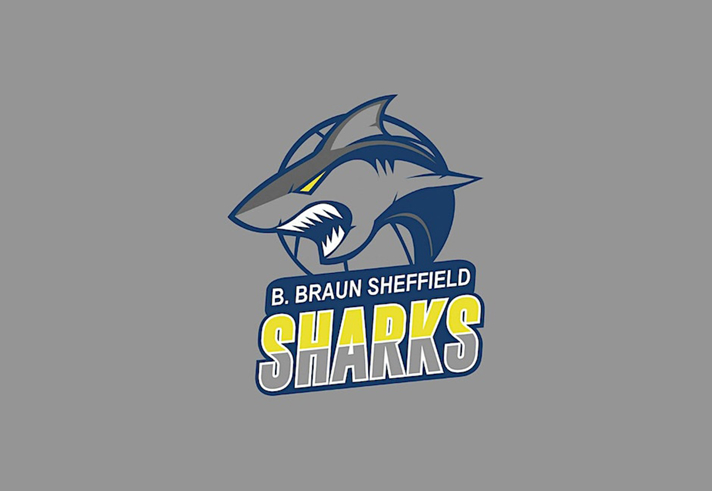 The Sheffield Sharks logo  - an illustration of a shark on a grey background above the words 'B. Braun Sheffield Sharks'.