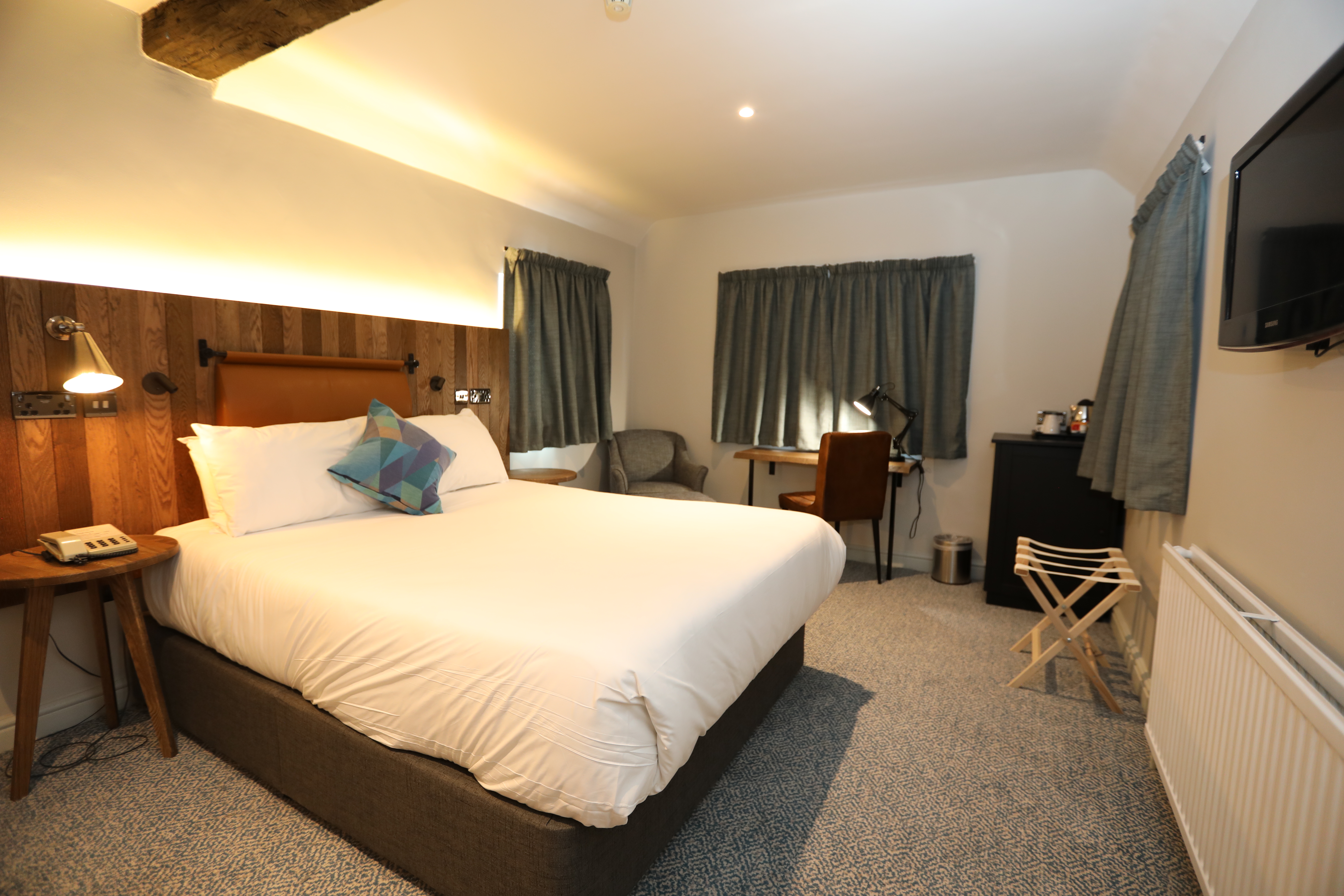 Double bedroom at Mercure Tankersley Manor with a comfortable bed, bedside tables, and soft lighting.