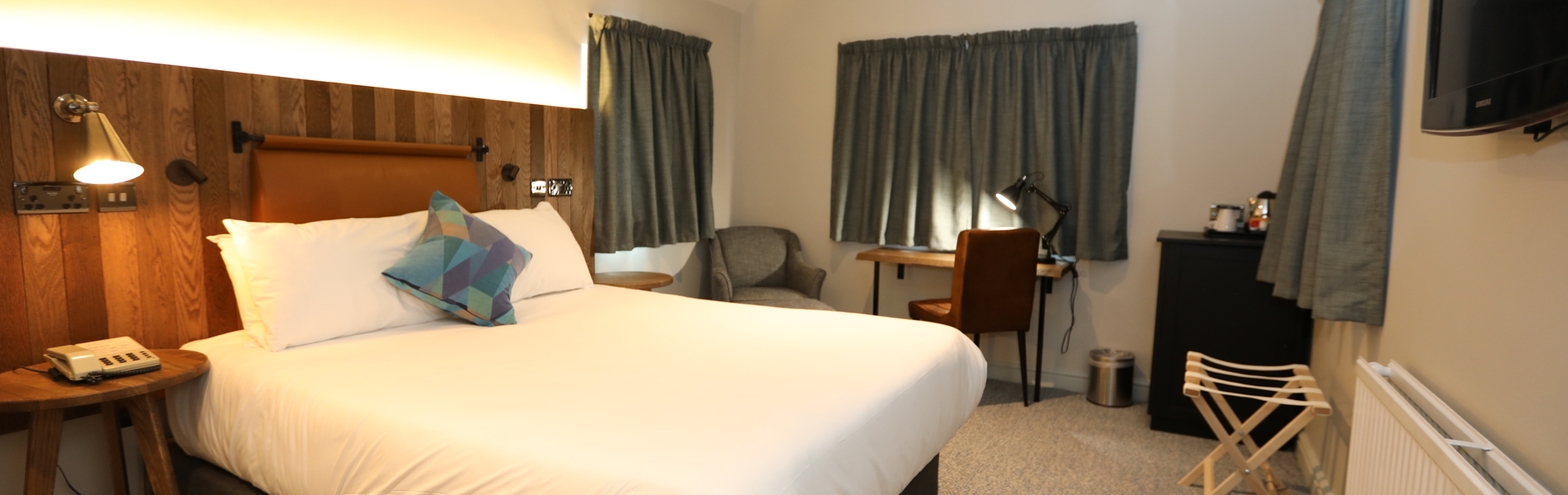 Double bedroom at Mercure Tankersley Manor with a comfortable bed, bedside tables, and soft lighting.