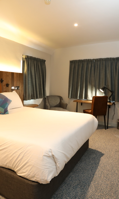 Double bedroom at Mercure Tankersley Manor with a comfortable bed, bedside tables, and soft lighting.