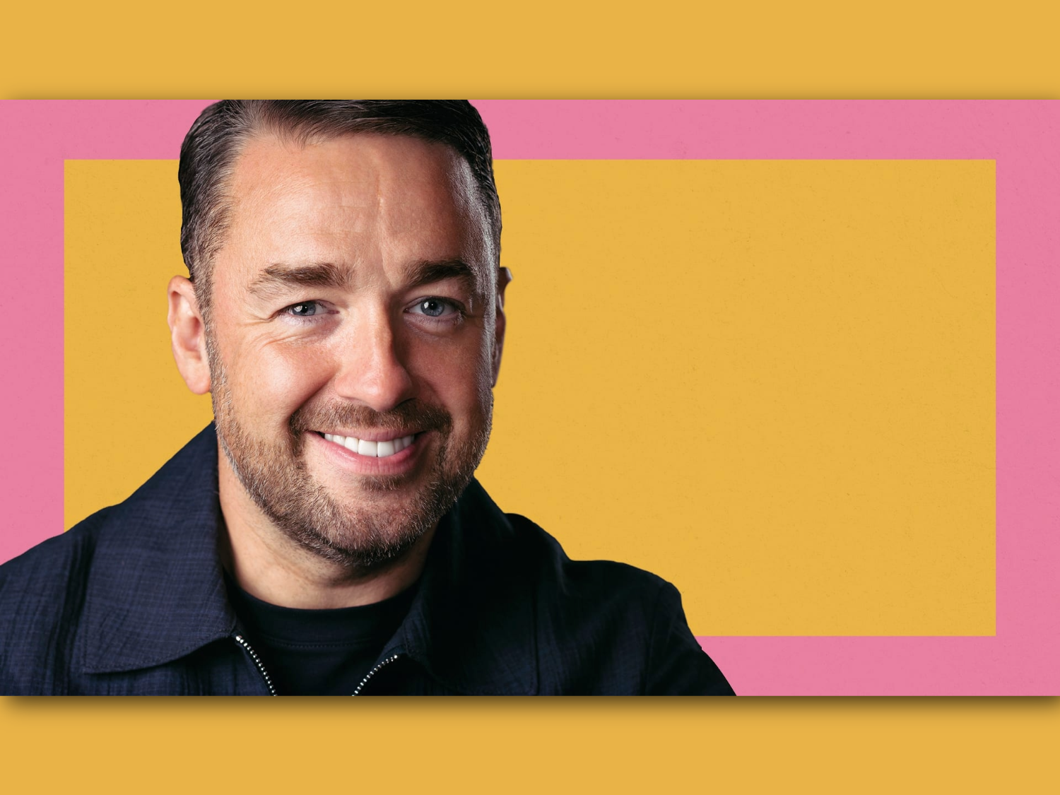 Person wearing a dark collared jacket against a vibrant background featuring a large yellow rectangle centered on a pink backdrop. The composition is simple and modern, with bold contrasting colours creating a striking visual effect.