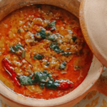 Sabzi vegetable curry, daal, naan bread, tomato chutney and coriander yoghurt chutney