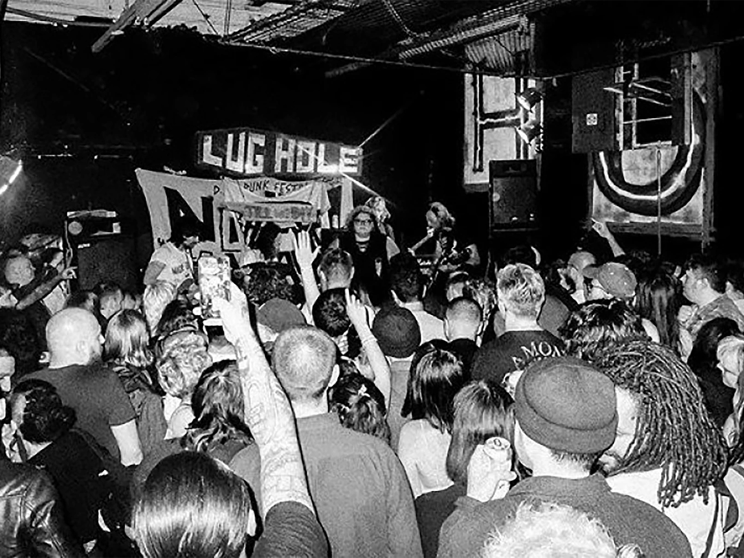 A black and white photo of a concert at The Lughole.