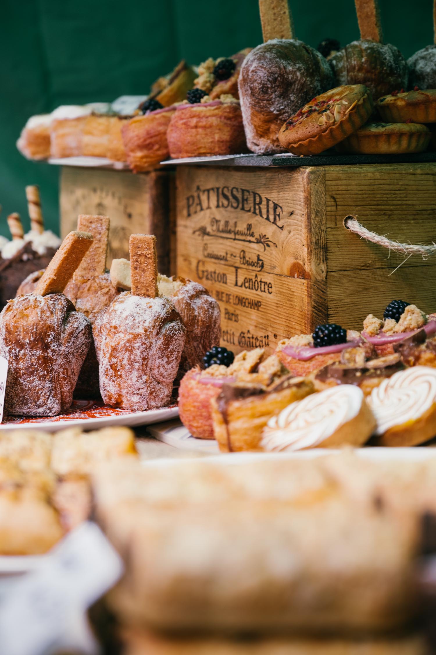 A market stall filled with artisan breads and pastries.