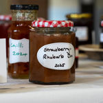 Homemade jams,, marmalades and chutneys on display at a horticultural show.