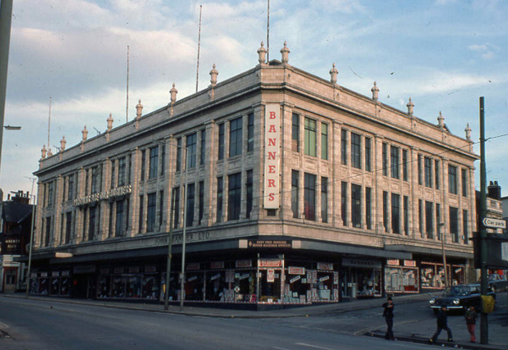 A large stone building in an urban setting.