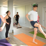 People in a yoga class.