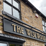 The sign above the door at The Wisewood Inn.
