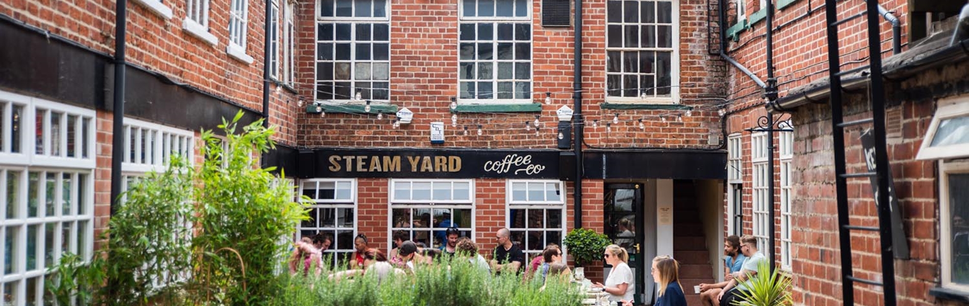 An exterior shot of Steam Yard, a popular coffee shop in Sheffield.