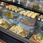 A glass fronted chiller cabinet full of delicious food and cakes at Raffina.