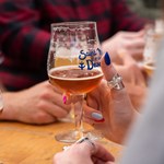 People enjoying a beer outdoors at The Brewery of St Mars of the Desert.