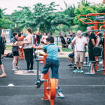 Crowds of people trying out sports at a previous taster session.